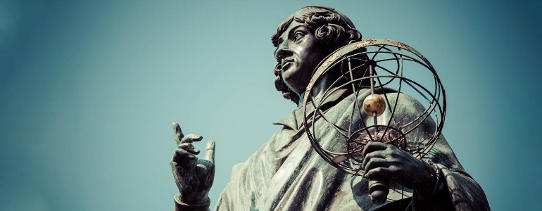 A statue of renaissance astronomer Nicolaus Copernicus holding an armillary sphere.