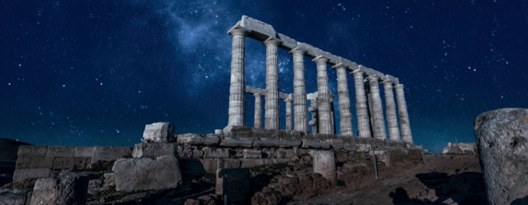 Acropolis of Athens in Greece under the starry night sky.