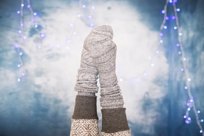 woolen mittens against the Christmas lights