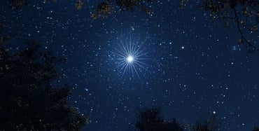 Bright white star in the night sky