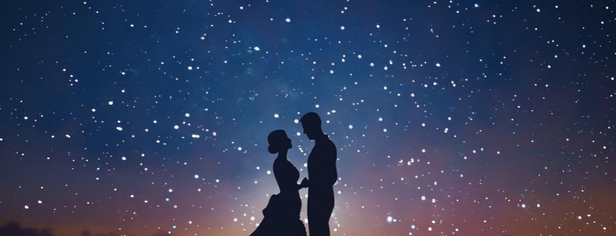 romantic couple watching night sky 