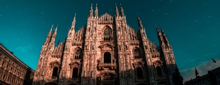 The starry night sky over the gothic cathedral from the Early Modern Period.