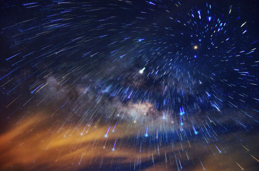 Night sky full of colorful bright stars and a Moon on the left side