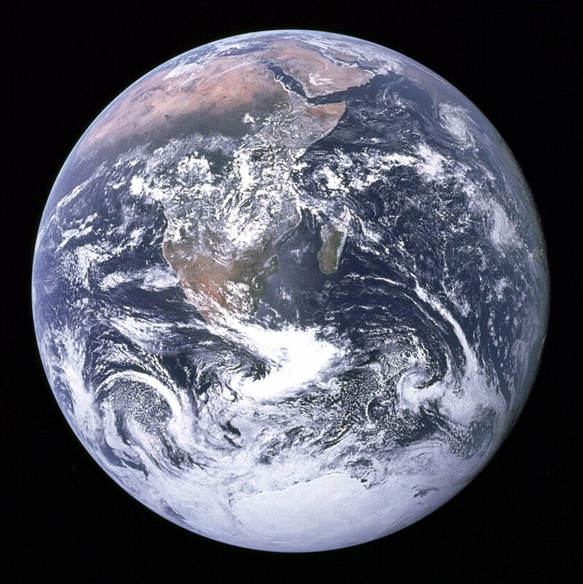 A picture from the cosmos where Earth can be seen very clearly resembling a glass marble