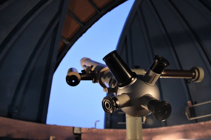 A telescope pointed at the sky in the observatory