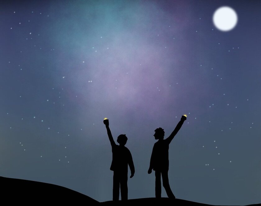 Two people standing in the dark and holding up lights towards the night sky and a full Moon