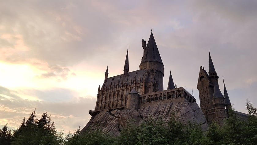 The school of Harry Potter universe with the sun setting in the background