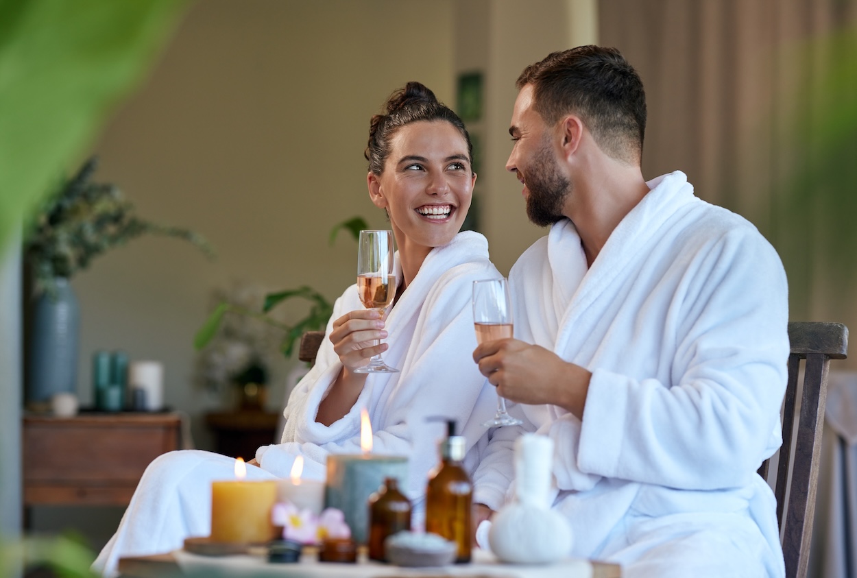 A couple drinking champagne at a spa.