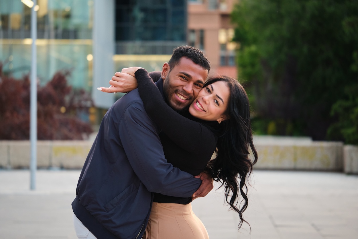 A couple posing for a romantic photoshoot.