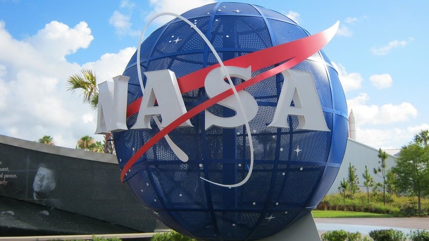 A sculpture of NASAs logo near the buildings