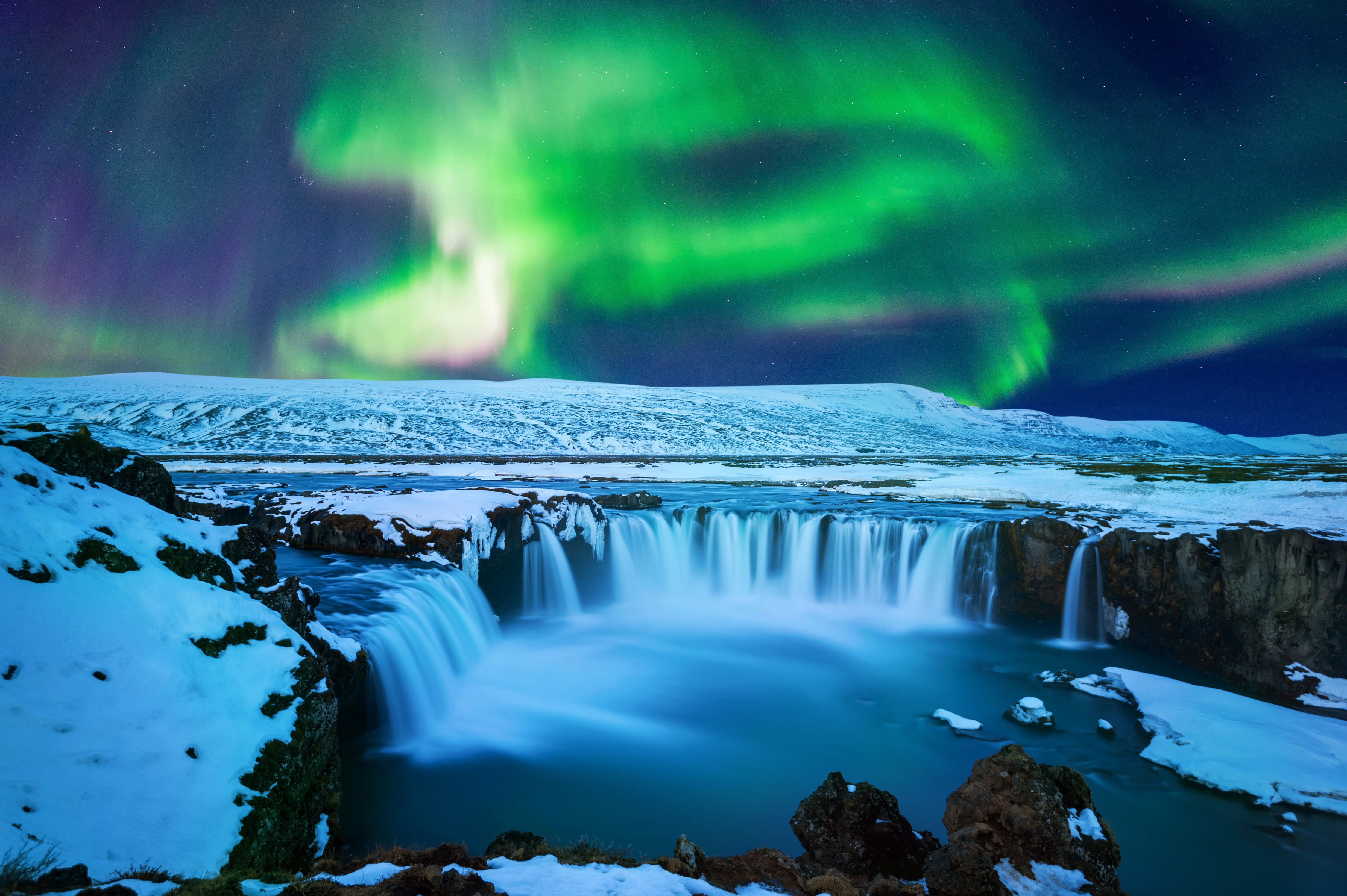 Northern Lights in Goðafoss waterfall, Iceland.