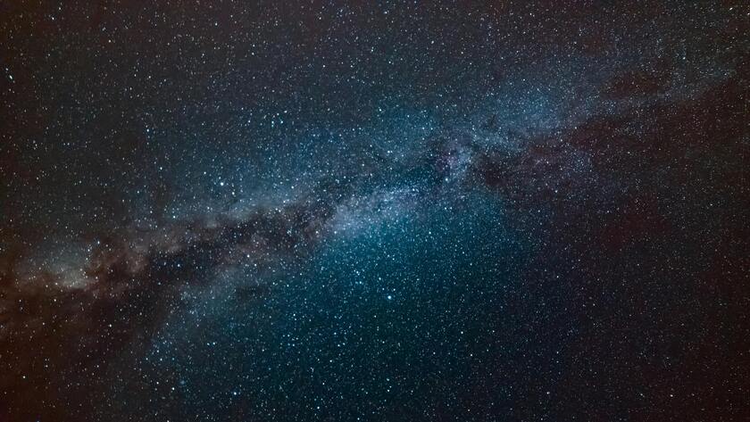 Milky Way shining brightly in blue night sky