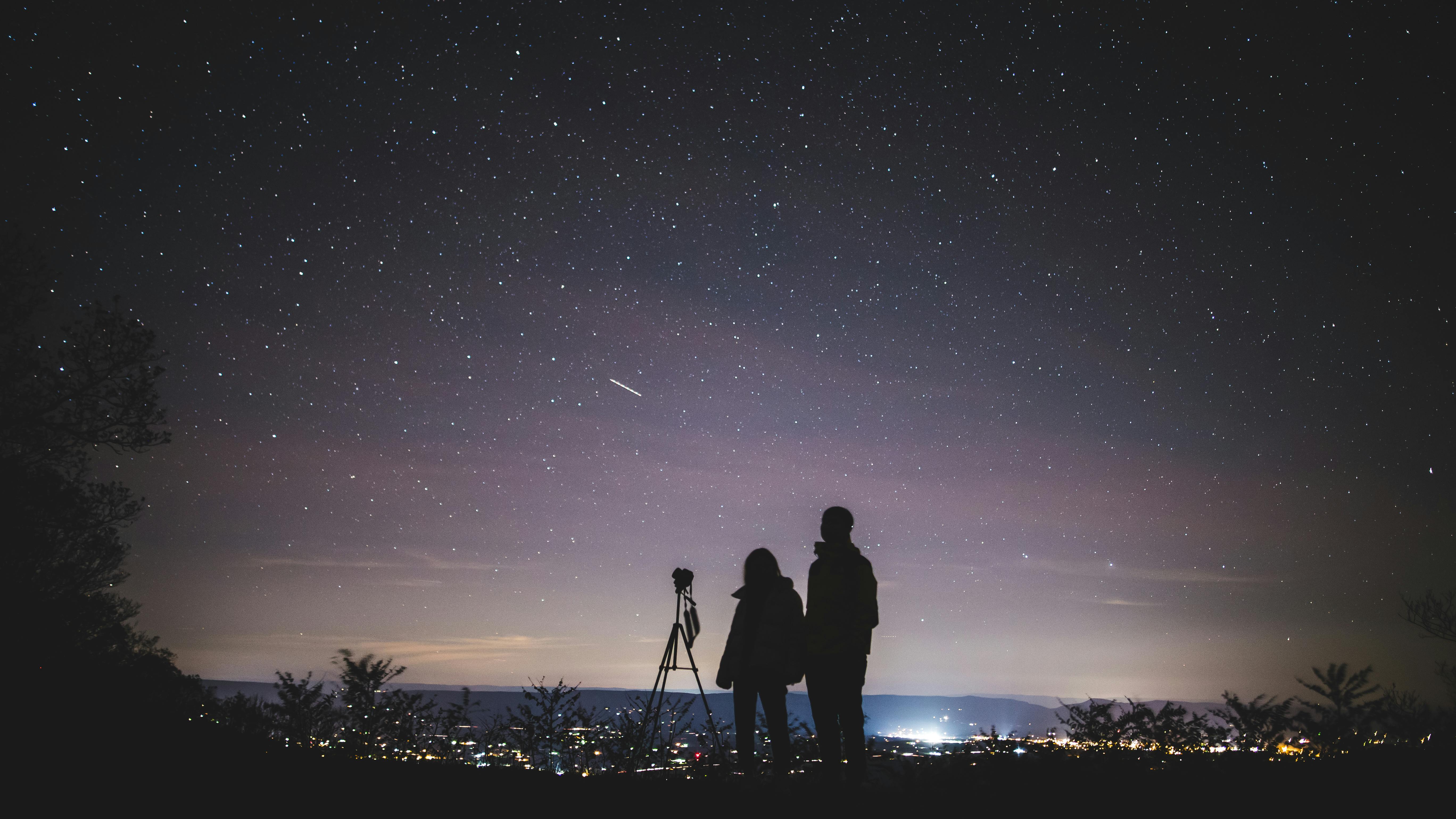 A family watching stars with a telescope