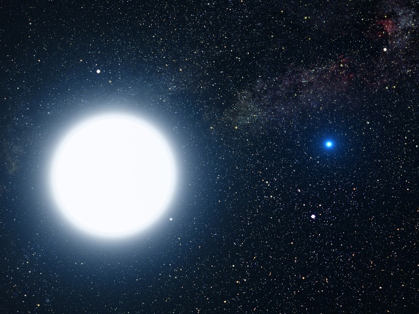 Massive white star and tiny blue star shining brightly in the night sky