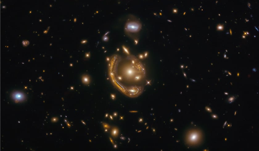 Small galaxies floationg in space with some warping arount the other